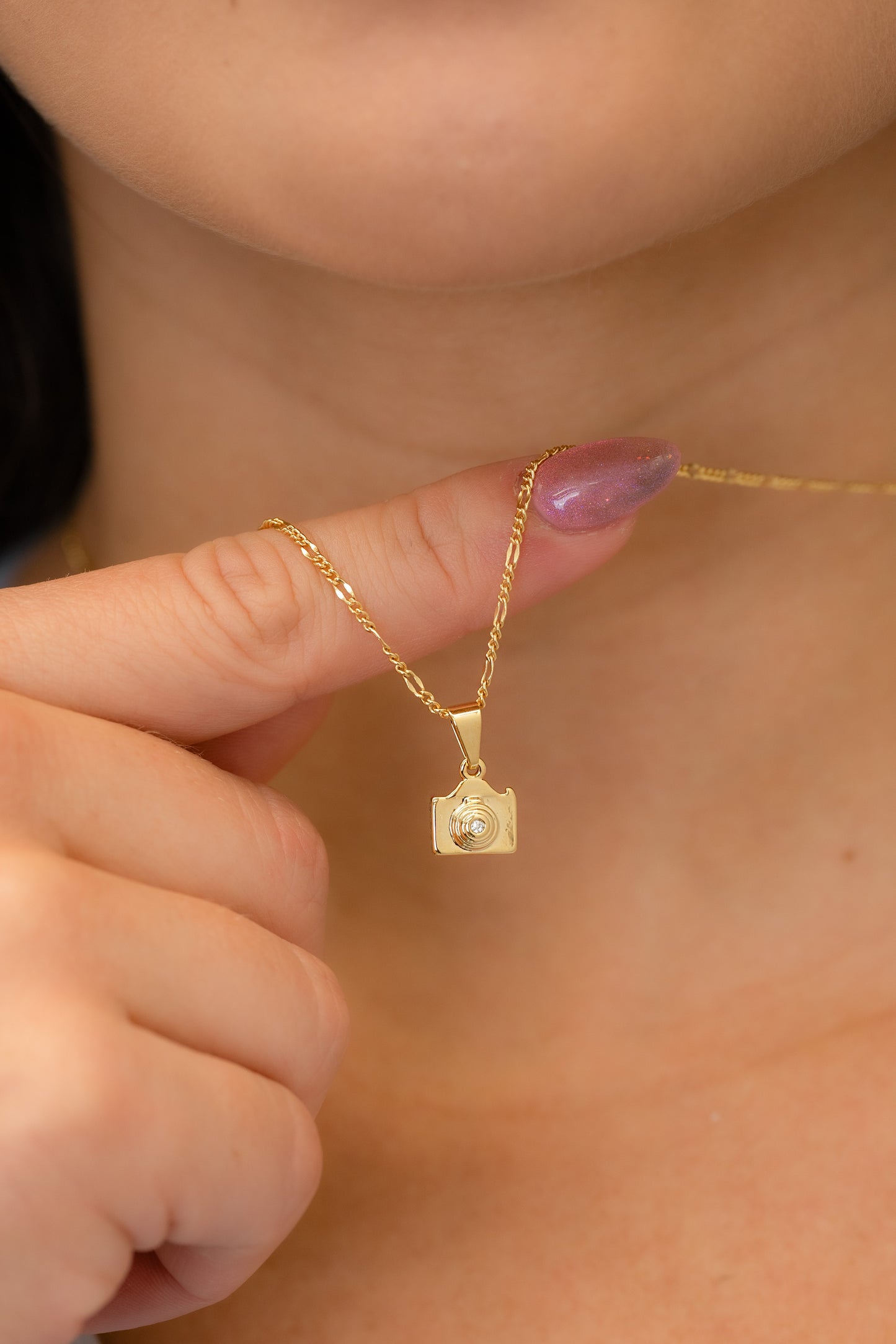 Dije cámara fotográfica