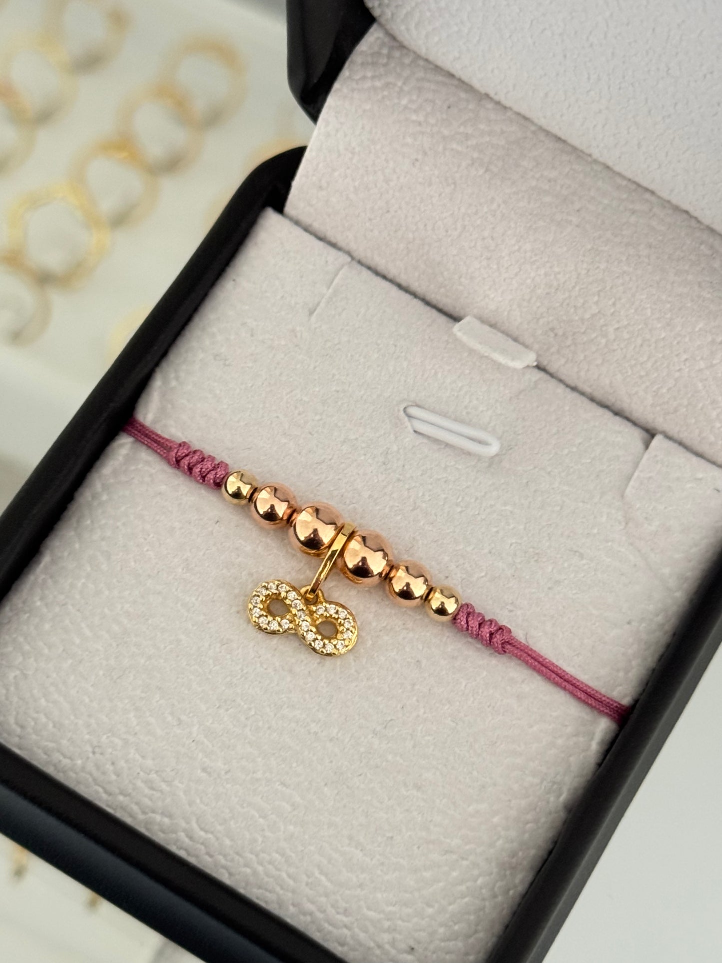 Pulsera infinito circonia oro rosa. N° de Balín: #4, #5 rosa, #6 rosa.