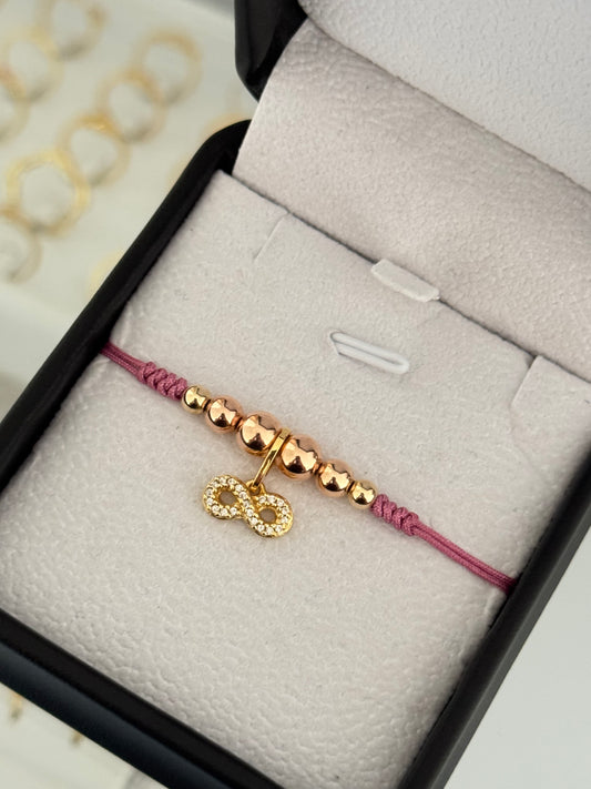 Pulsera infinito circonia oro rosa. N° de Balín: #4, #5 rosa, #6 rosa.